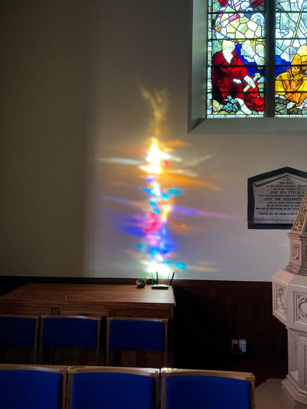 refracted light through a stained glass window